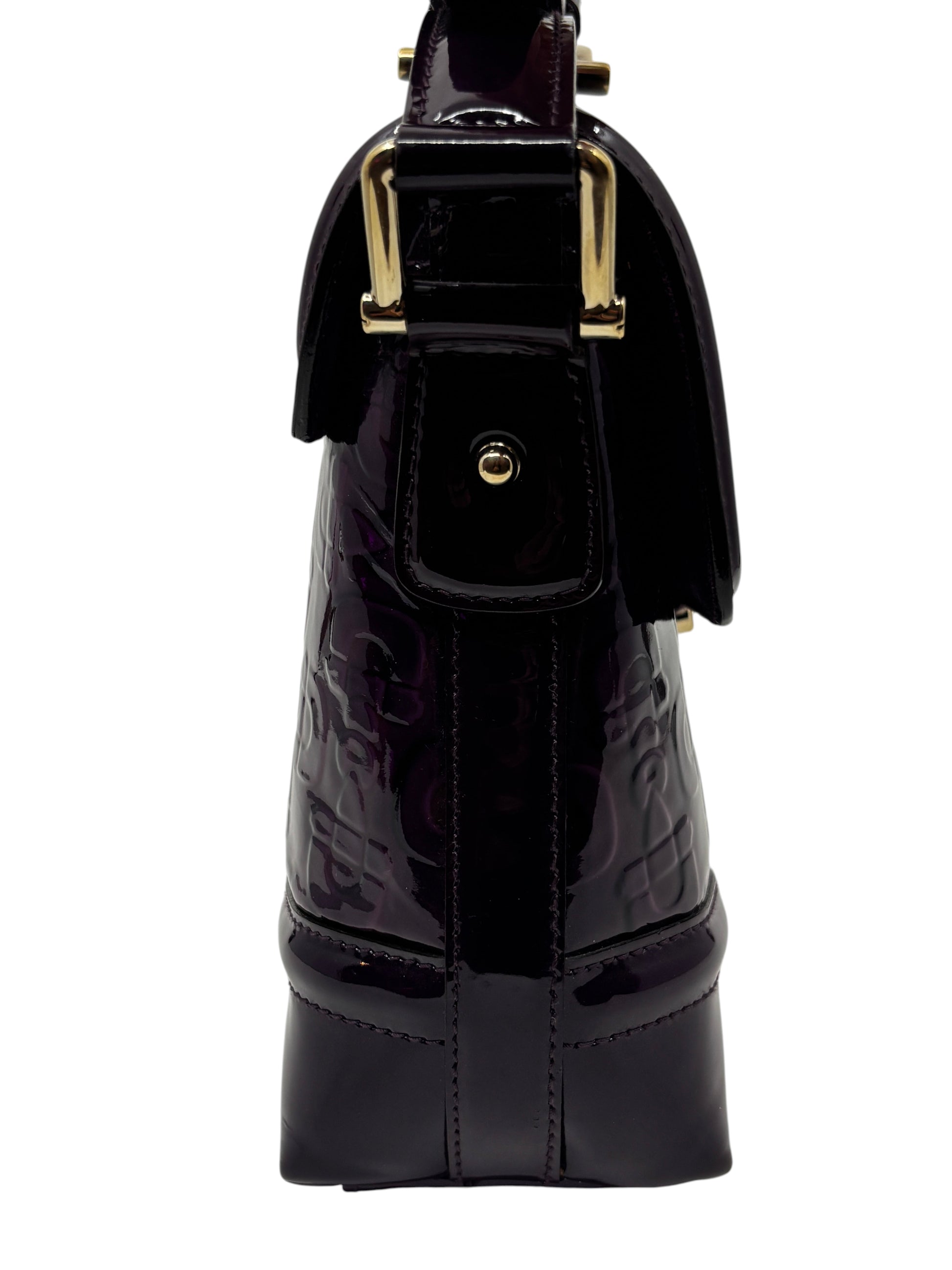 Posh Purse Co. purple patent leather Gucci Horsebit Treasure bag side view with gold hardware details.