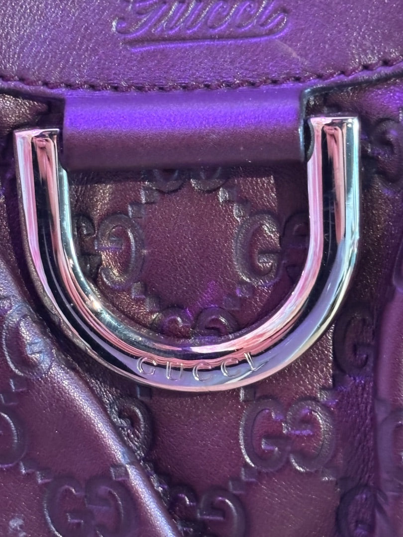 Posh Purse Co. purple embossed Guccissima leather handbag with silver hardware and Gucci logo detail.