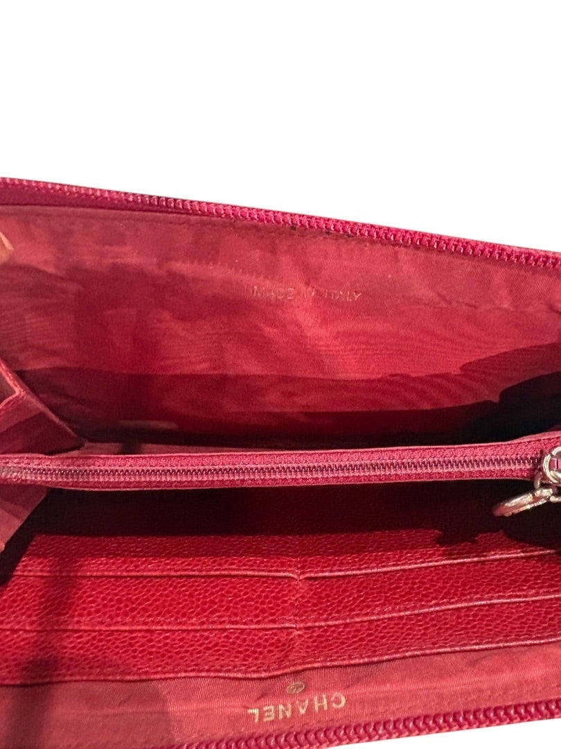 Posh Purse Co red vintage Chanel caviar leather zip around wallet with multiple card slots and zippered coin pocket.