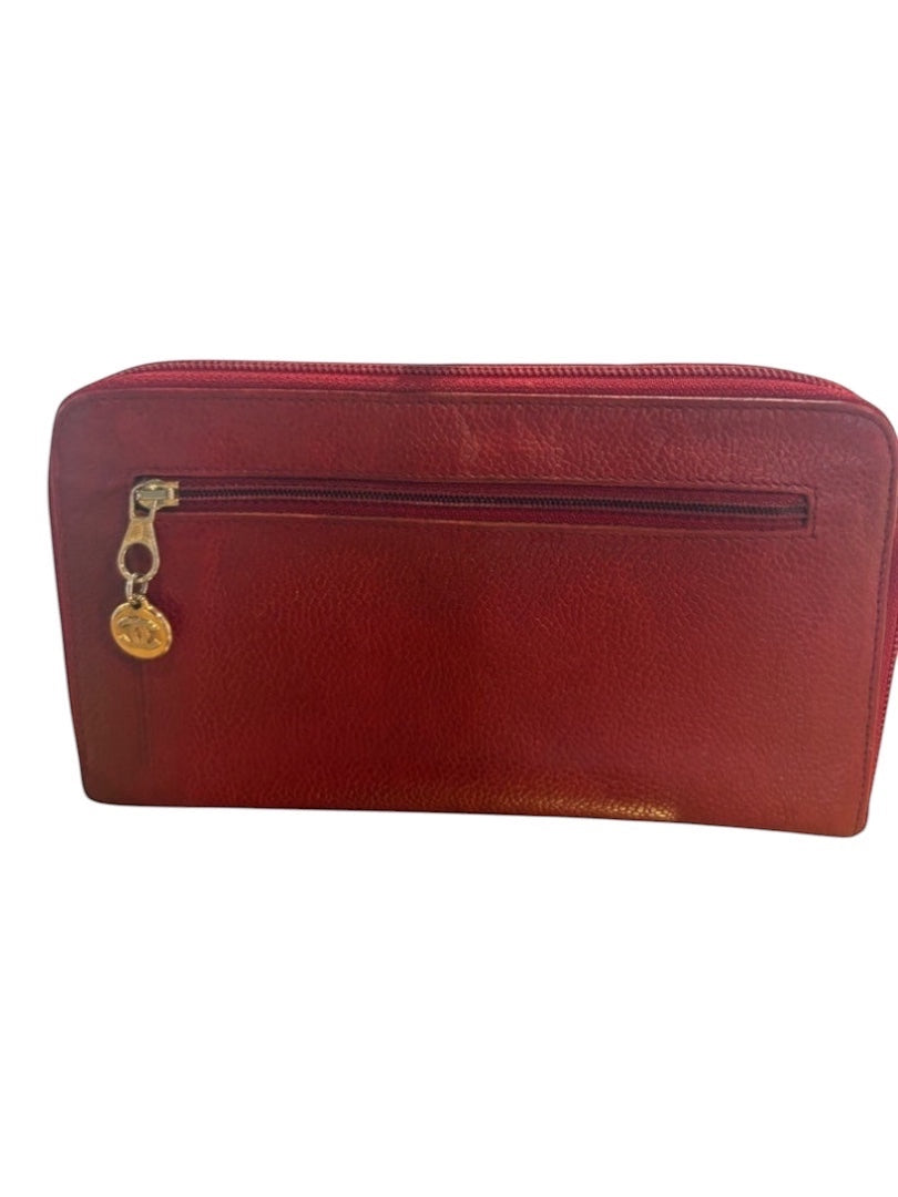 Posh Purse Co red vintage Chanel caviar leather zip-around wallet with gold charm.