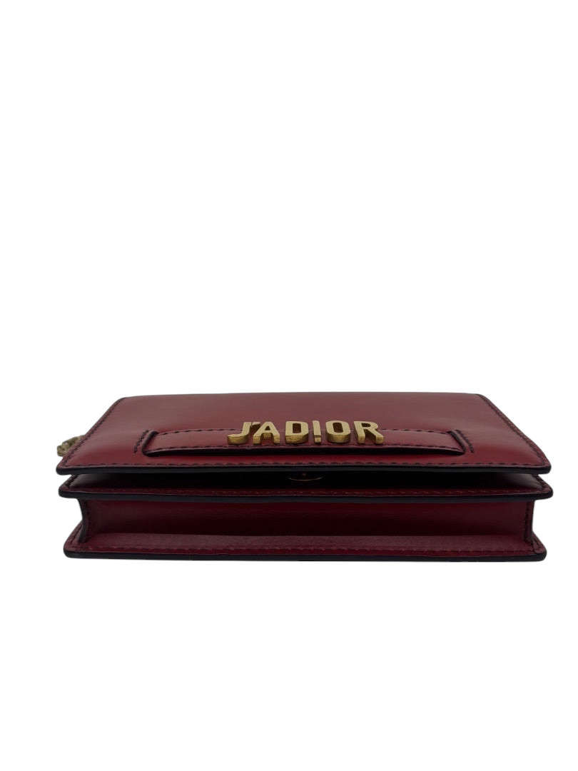 Posh Purse Co. red Dior J'adior crossbody bag with gold-tone logo hardware and structured leather silhouette.