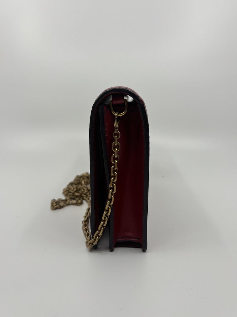 Side view of a red Dior J'adior crossbody bag with gold chain strap, available at Posh Purse Co.