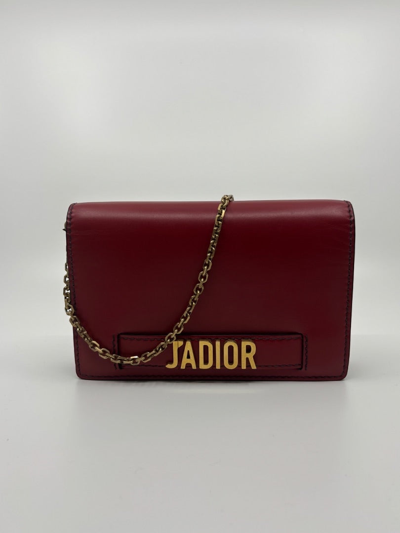 Posh Purse Co. preloved red Dior J'adior leather crossbody bag with gold-tone hardware and chain strap.