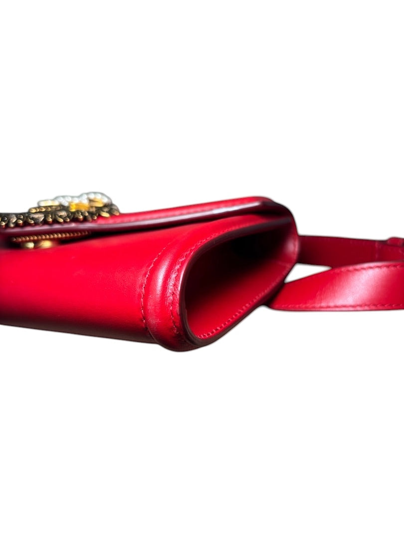 Posh Purse Co. red leather Dolce & Gabbana Devotion belt bag with gold-tone hardware and iconic heart emblem.