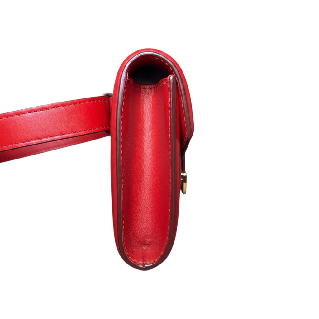 Posh Purse Co. red leather Dolce & Gabbana Devotion belt bag with gold-tone hardware and iconic heart emblem.