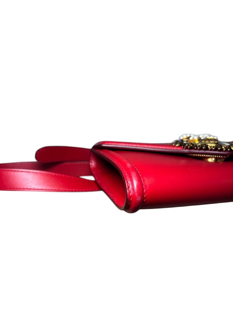 Posh Purse Co. red leather Dolce & Gabbana Devotion belt bag with gold heart emblem and adjustable strap.