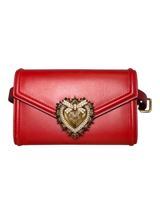 Posh Purse Co. red leather Dolce & Gabbana Devotion belt bag with gold heart emblem and pearl details.