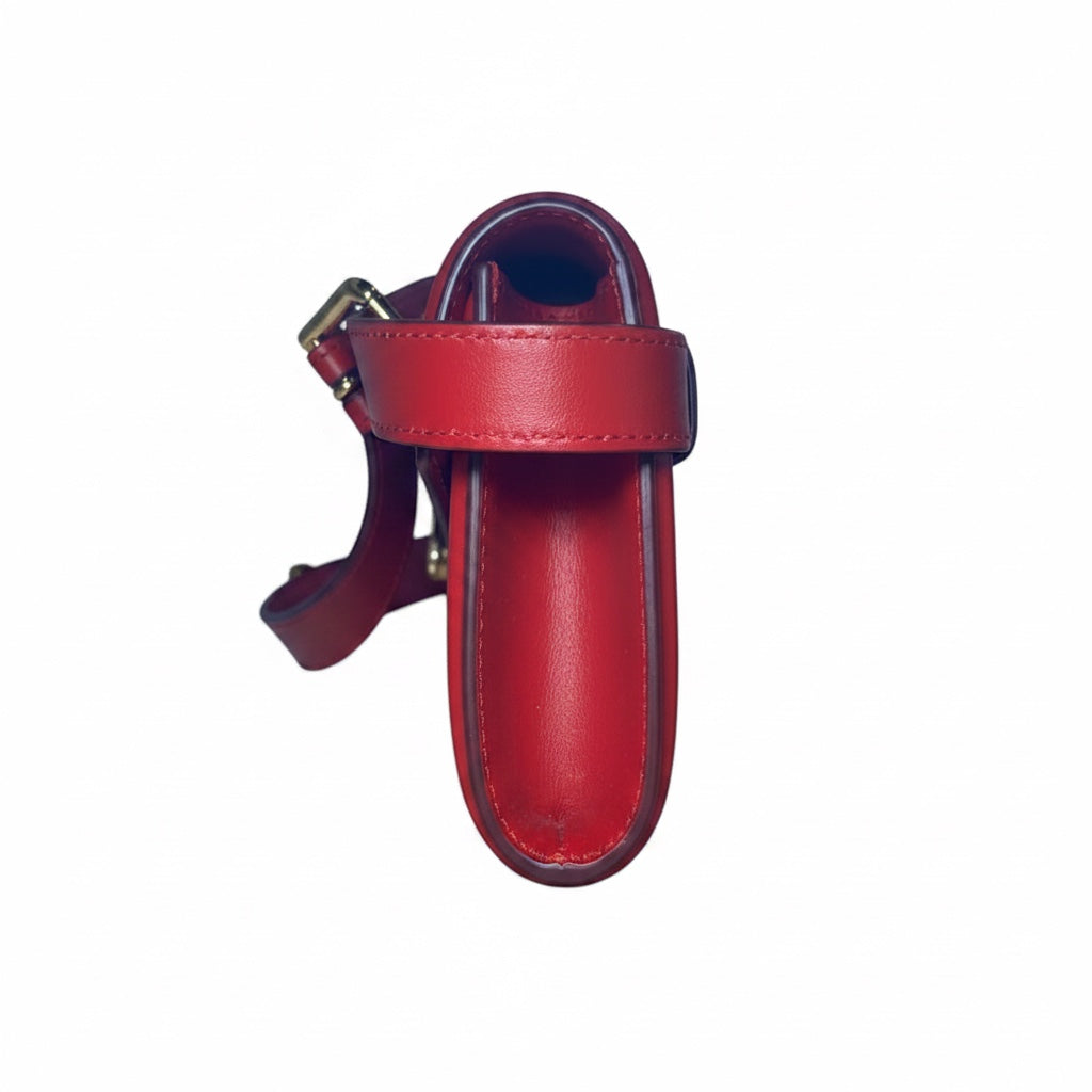Posh Purse Co. red leather Dolce & Gabbana Devotion belt bag with gold-tone hardware and flap closure.