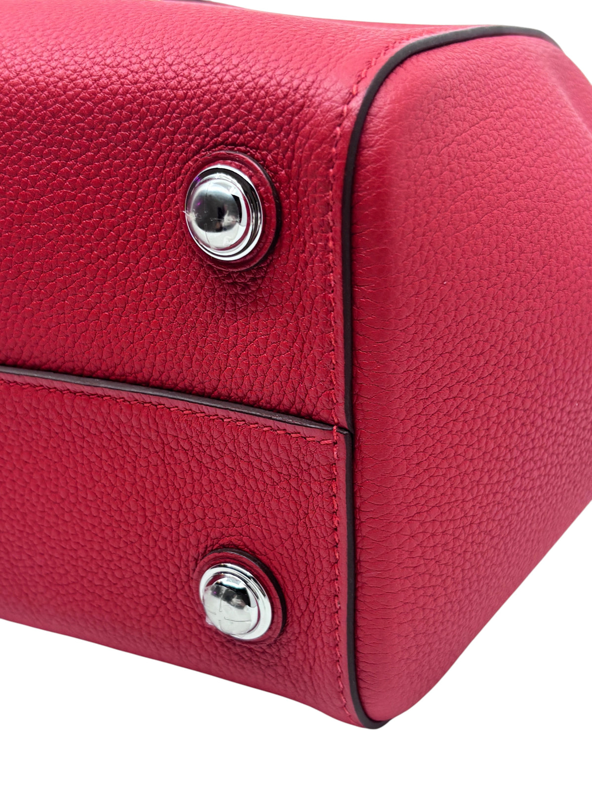 Posh Purse Co red Hermes Petit Tour 24 handbag showing the textured leather base and polished silver hardware studs