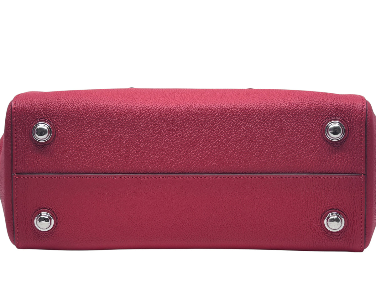 Posh Purse Co red Hermes Petit Tour 24 bag base showing protective silver feet and textured leather construction