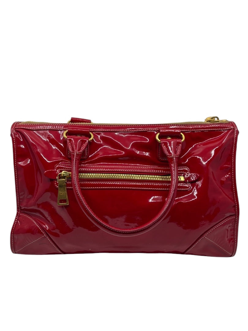 Posh Purse Co. red Prada Vernice patent leather east/west shoulder bag with gold hardware and front zip pocket.