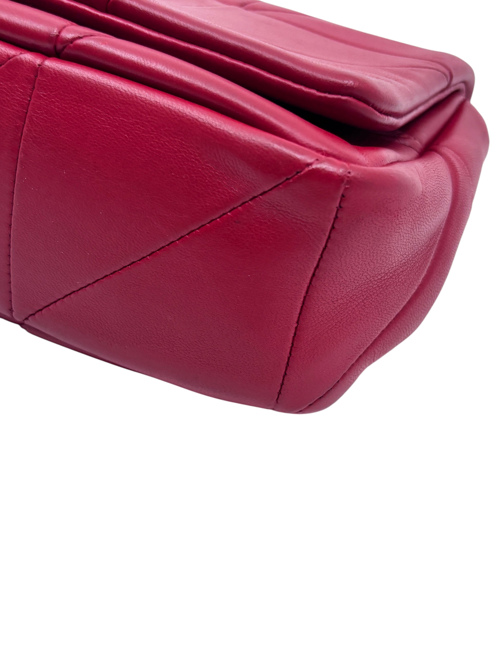 Posh Purse Co. red Saint Laurent Jamie crossbody bag showing the quilted leather texture and corner detail.