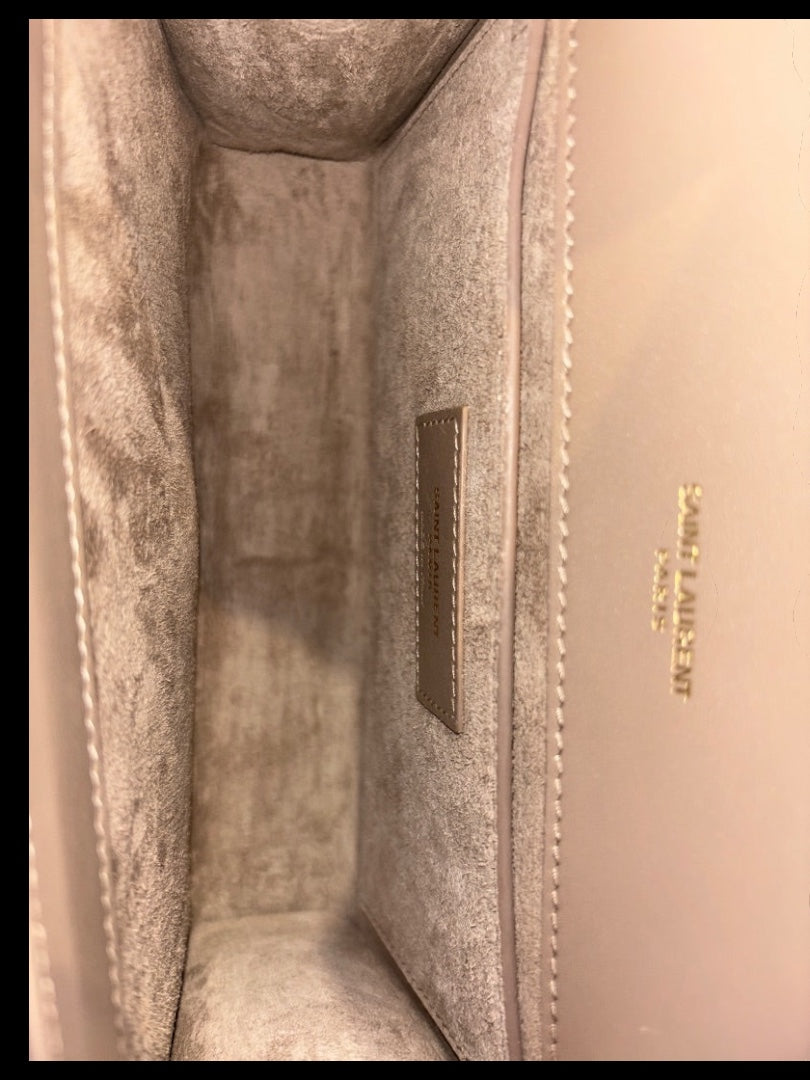 Posh Purse Co. Saint Laurent beige leather crossbody bag interior with gold-tone logo detail.