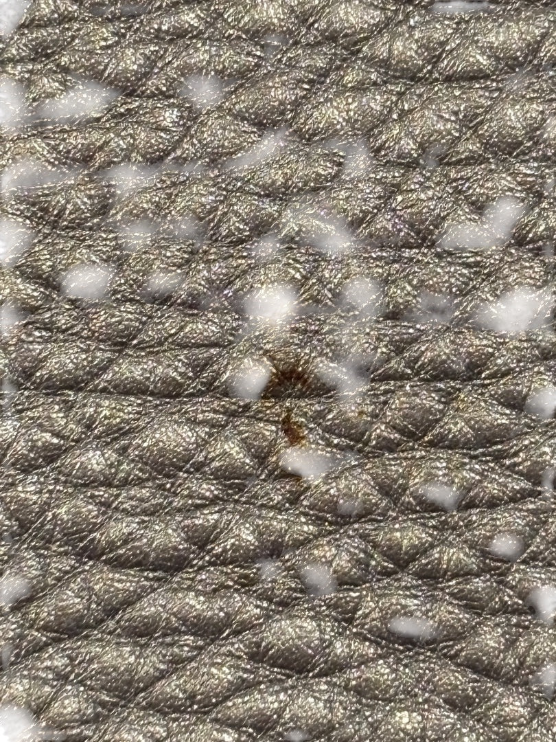 Posh Purse Co. silver metallic leather Fendi Baguette with quilted texture and visible surface wear.