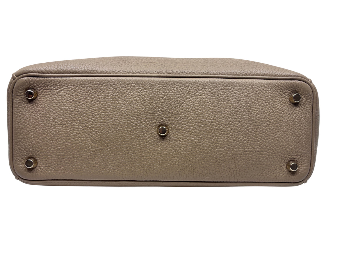 Posh Purse Co tan Dior Diorissimo leather tote bag bottom view showing protective metal feet and pebbled texture