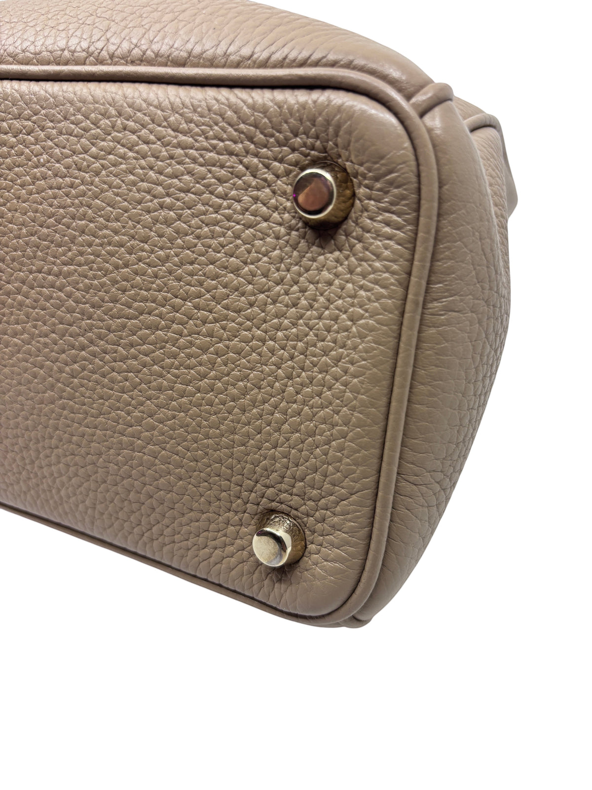 Posh Purse Co tan Dior Diorissimo leather tote bag base with protective metal feet and pebbled leather texture
