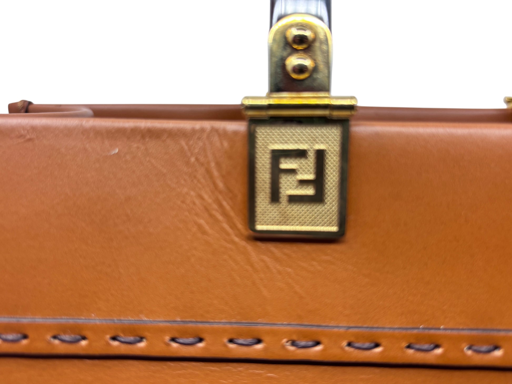 Posh Purse Co tan leather Fendi Sunshine bag featuring gold-tone hardware with the iconic Fendi logo detail.