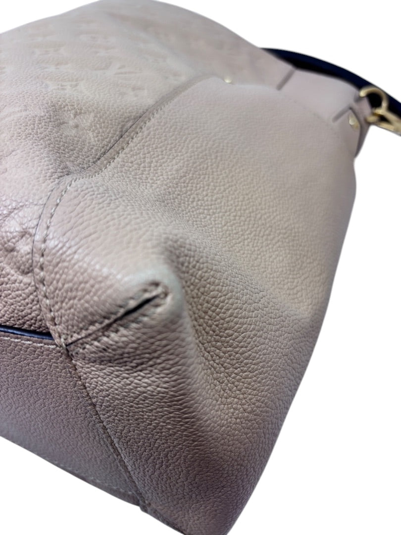 Posh Purse Co tan Louis Vuitton Empreinte Bagatelle hobo bag showing corner detail and embossed monogram leather