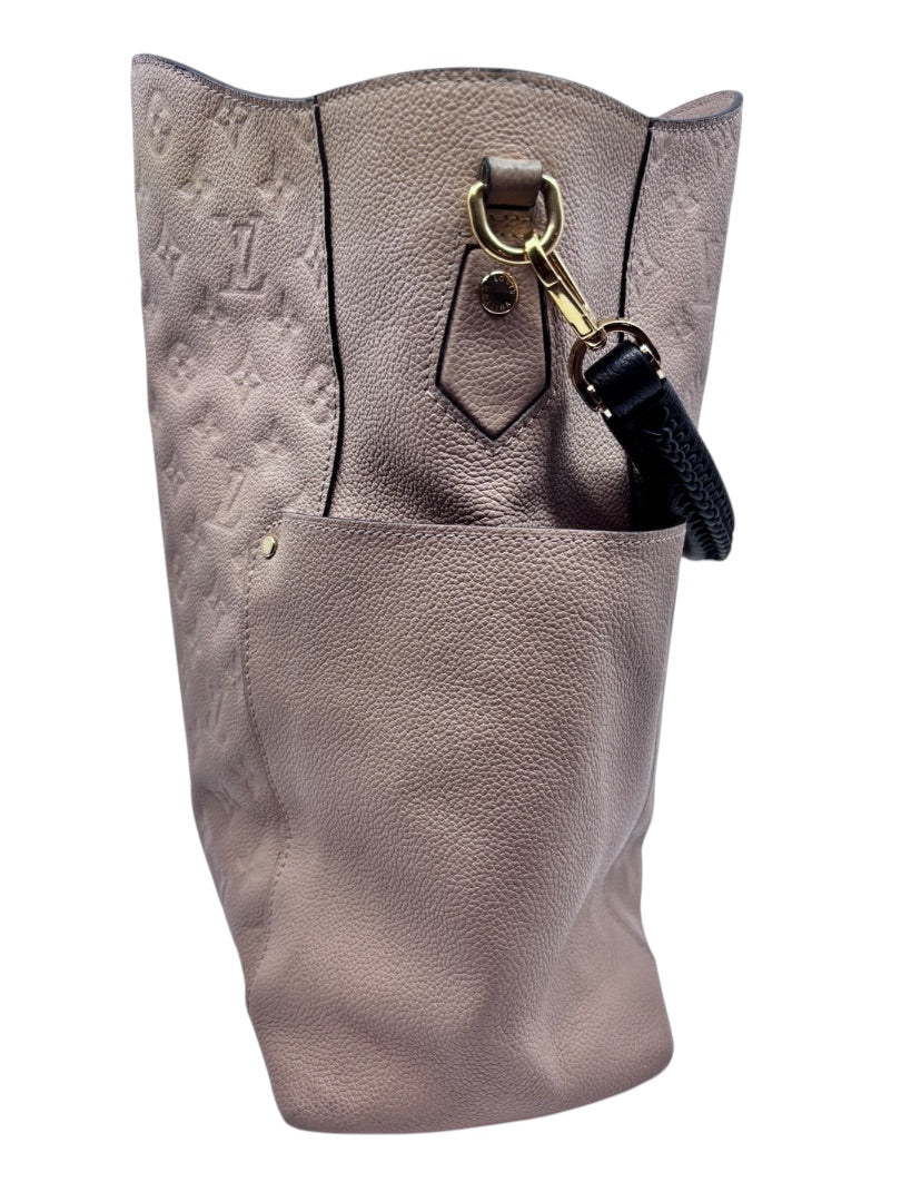 Posh Purse Co tan Louis Vuitton Empreinte Bagatelle hobo bag featuring embossed monogram leather and gold hardware