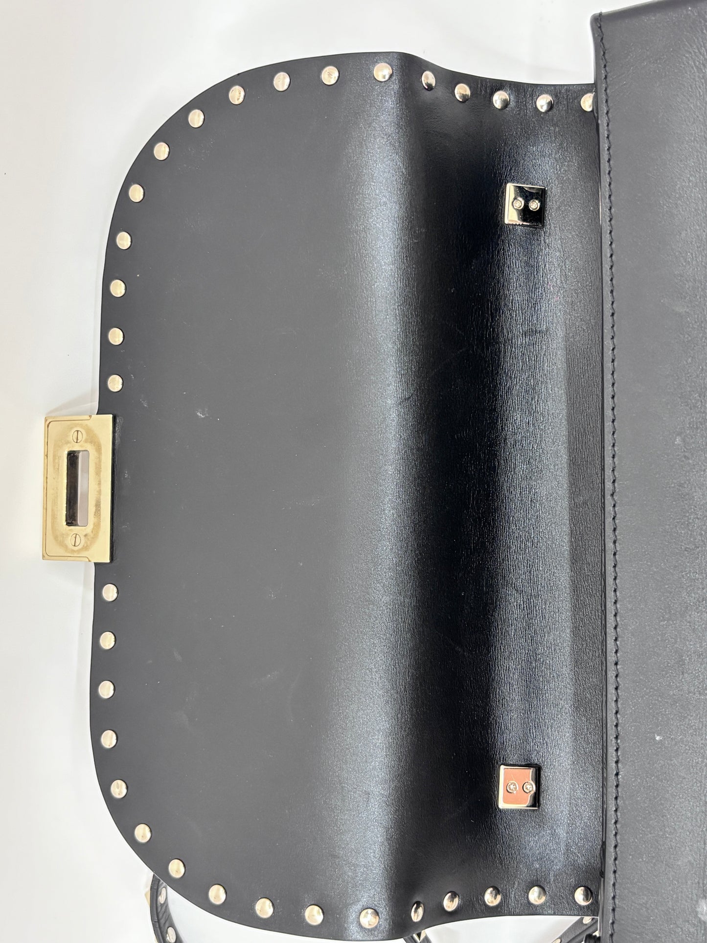 Posh Purse Co. preloved black Valentino Rockstud flap bag with gold-tone flip-lock closure and signature stud detailing.