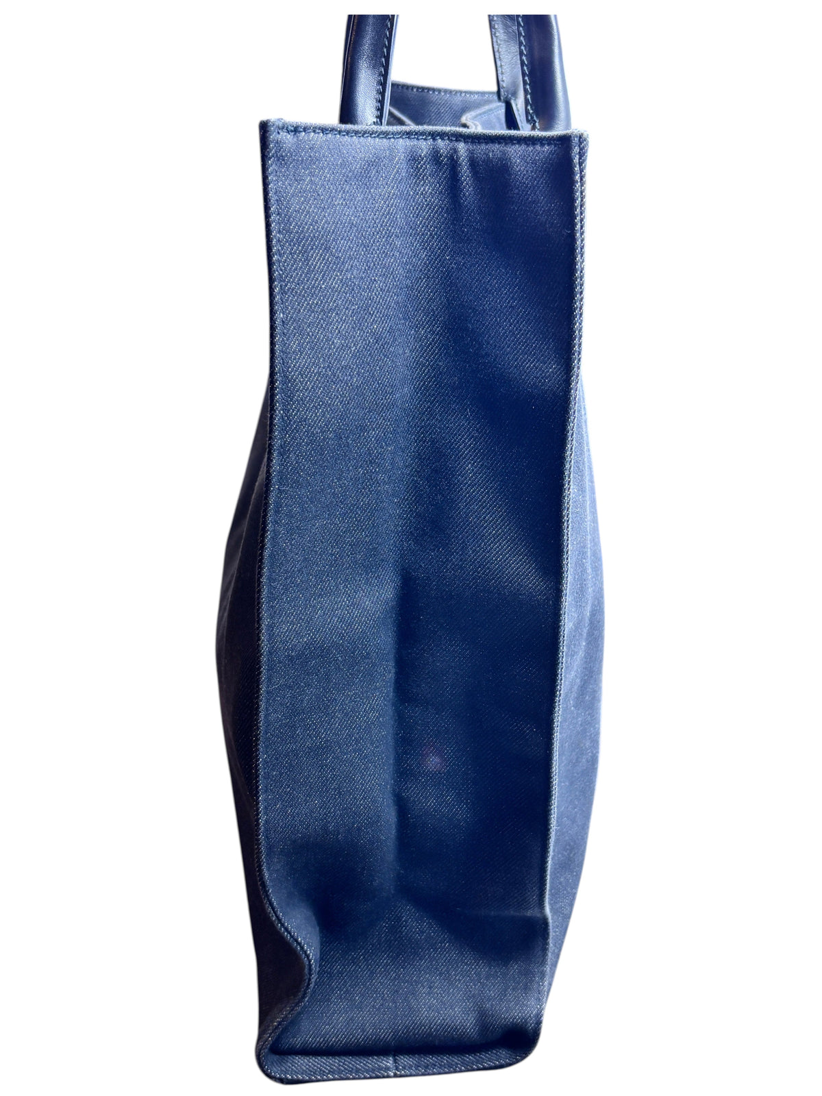 Side view of a vintage black Gucci shopper tote bag from Posh Purse Co. featuring a structured canvas silhouette.