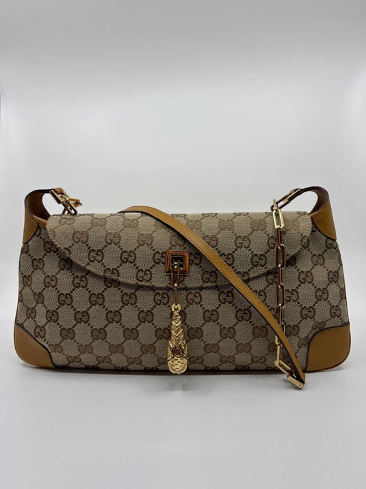 Posh Purse Co. vintage Gucci GG monogram canvas shoulder bag with gold-tone tiger head charm and tan leather trim.