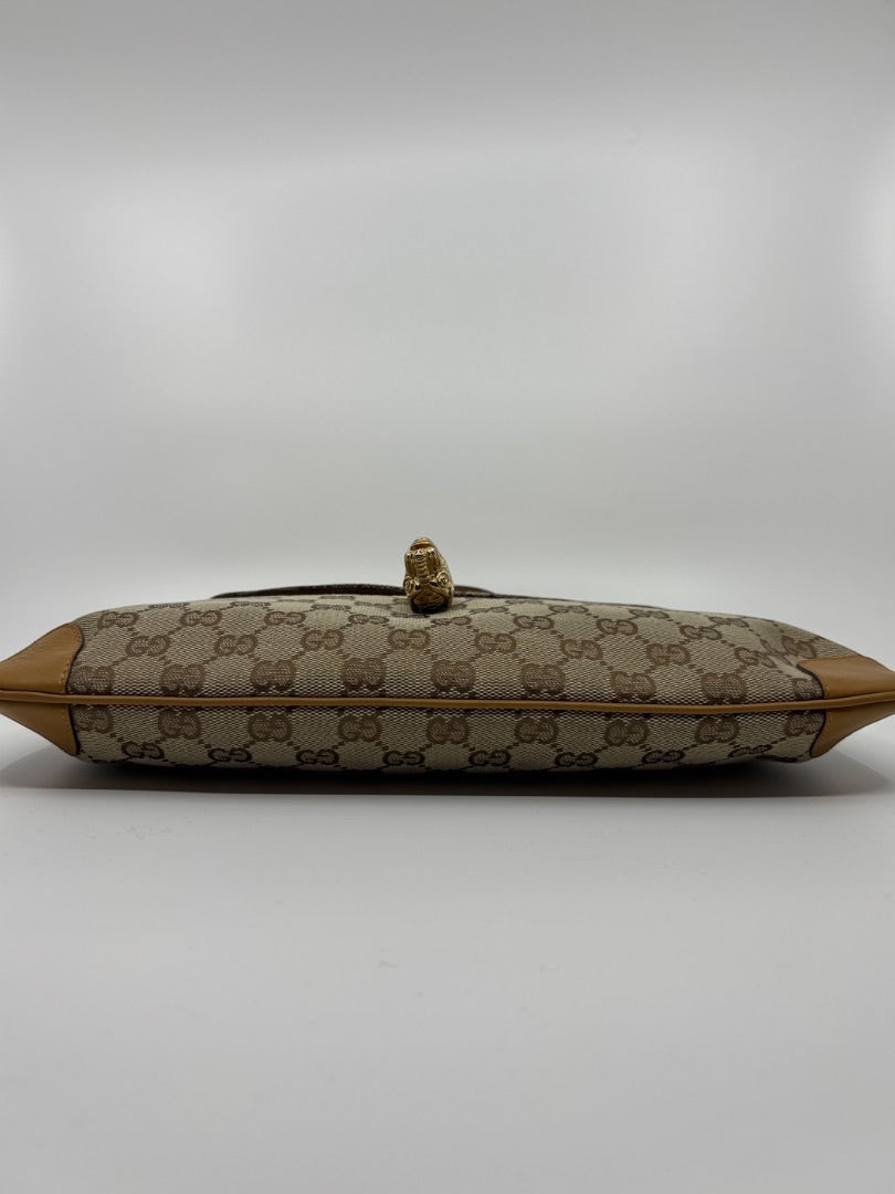 Posh Purse Co. vintage Gucci GG monogram canvas shoulder bag with gold-tone tiger head detail in pristine condition.