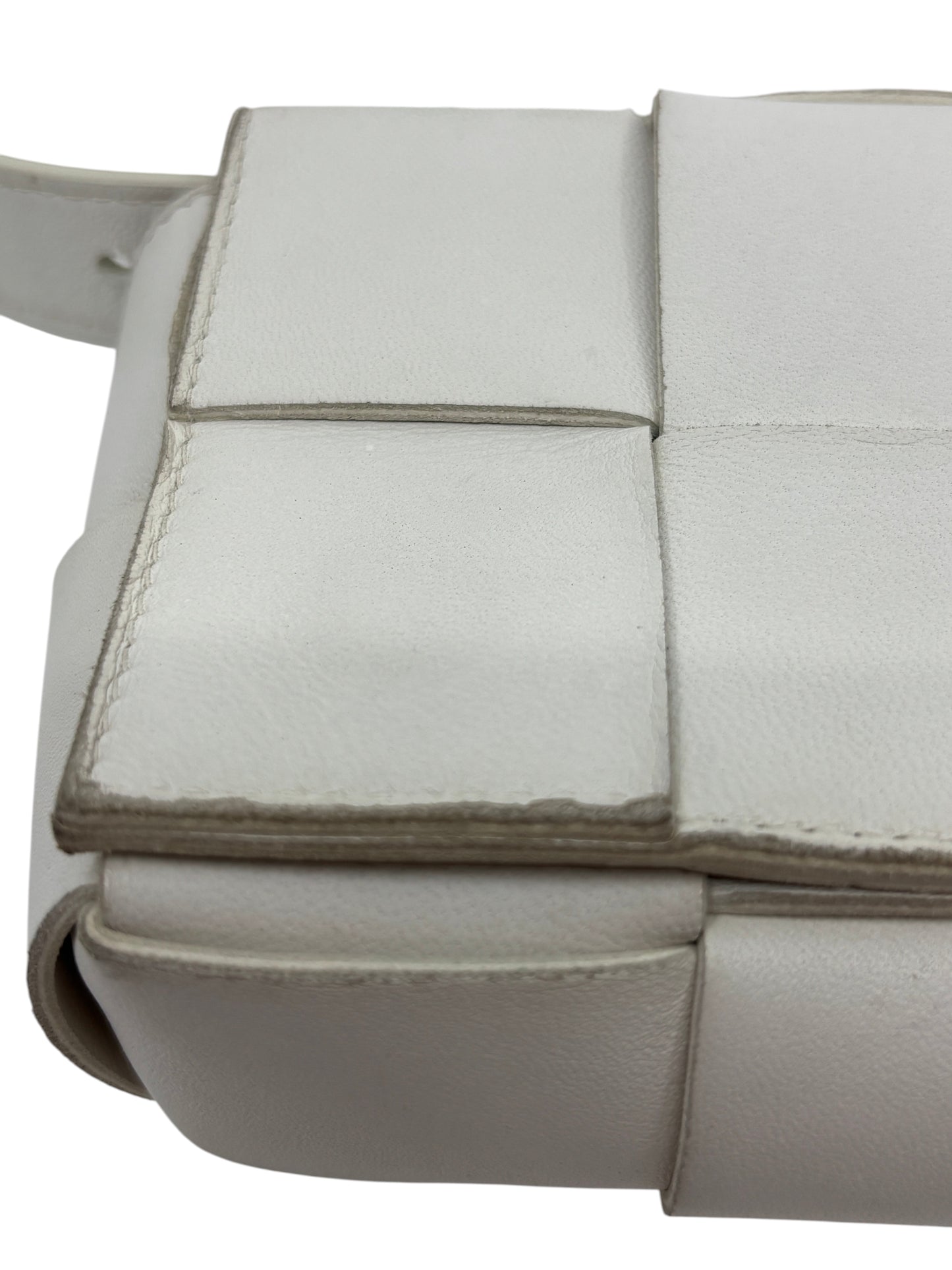 Posh Purse Co white Bottega Veneta Cassette bag featuring signature padded Intrecciato woven leather detail.