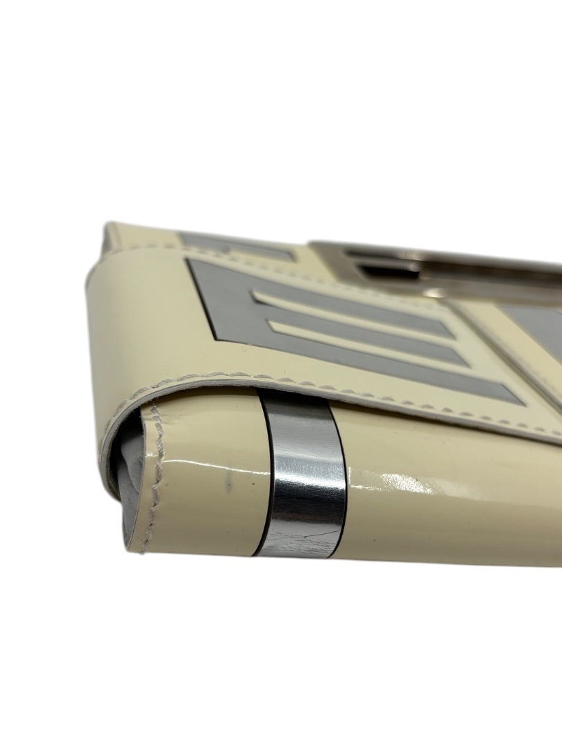Posh Purse Co. white Fendi Crossword clutch featuring sleek metallic silver accents and structured patent leather