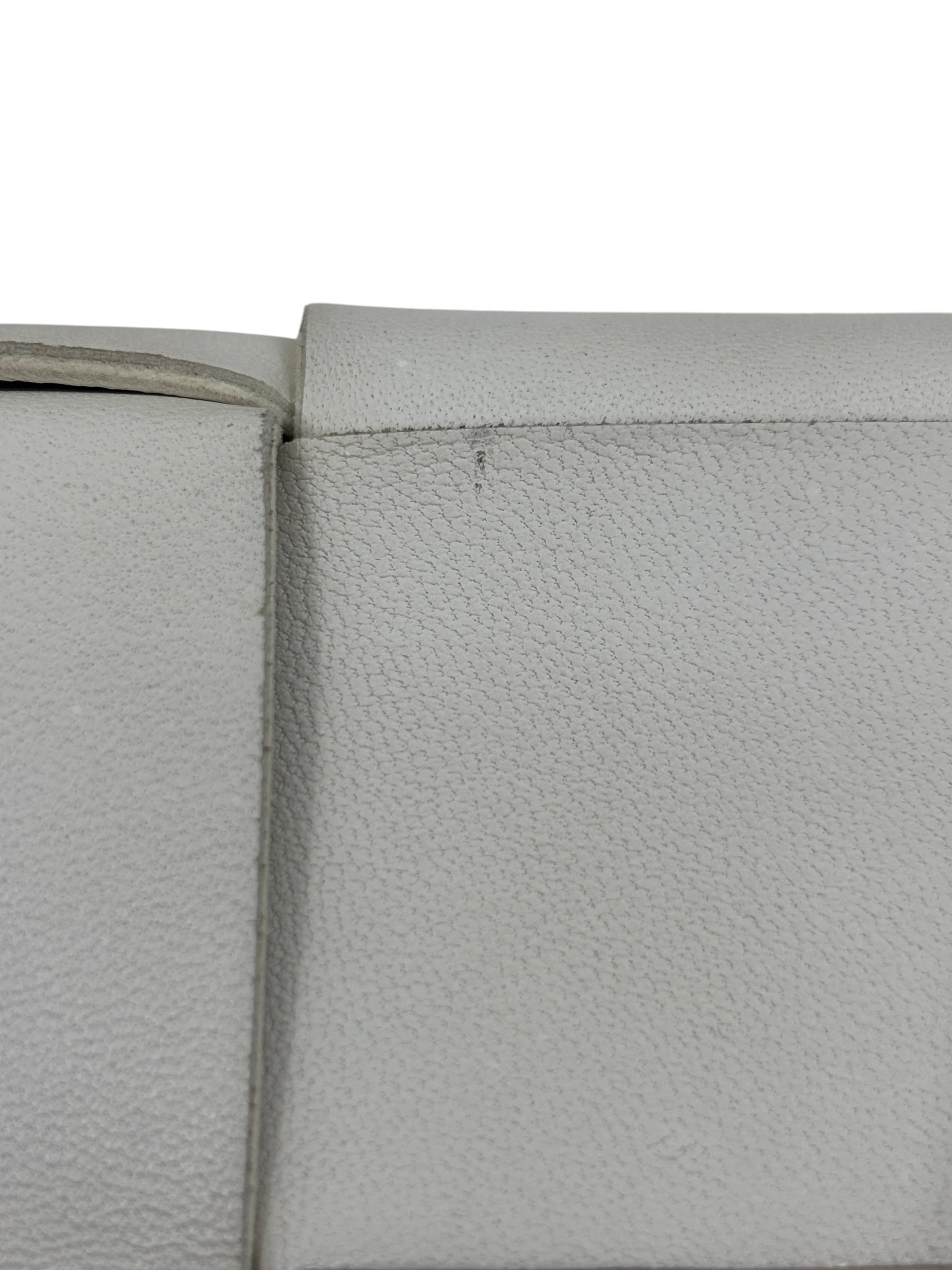 Close-up of white leather texture on a Posh Purse Co Bottega Veneta Cassette bag showing minor surface wear