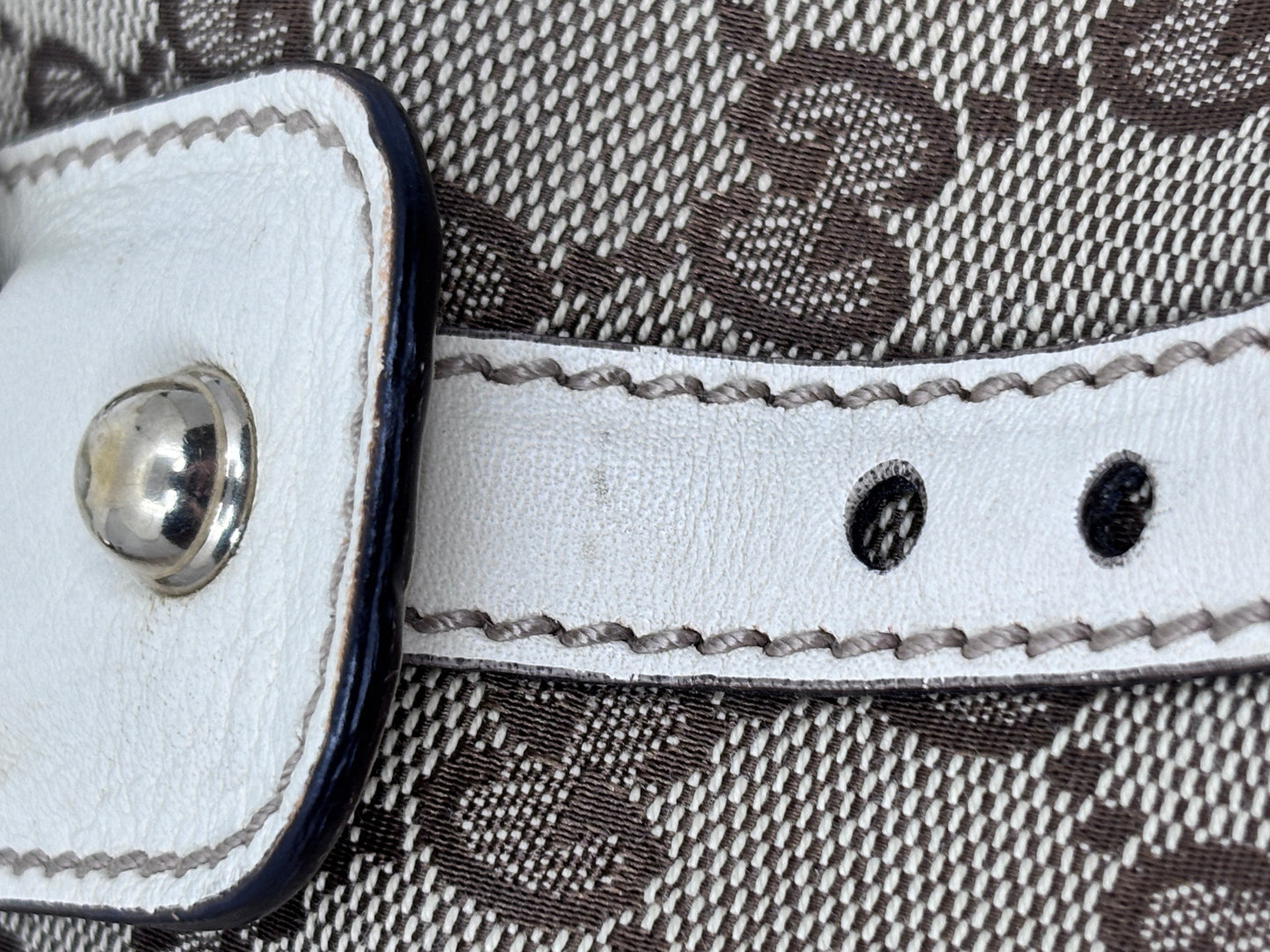 Posh Purse Co white leather handbag strap detail with silver hardware and contrast stitching