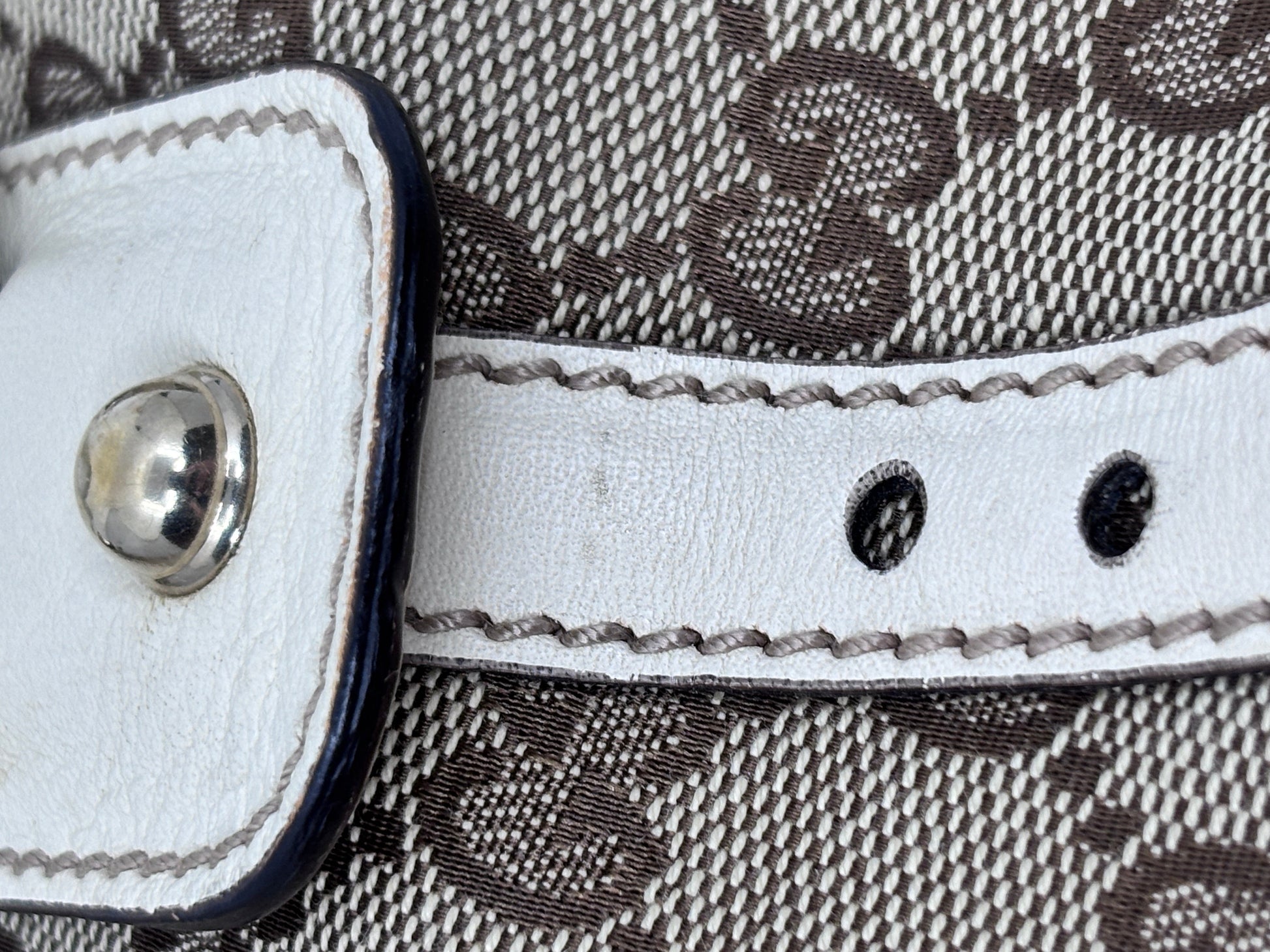 Posh Purse Co white leather handbag strap detail with silver hardware and contrast stitching