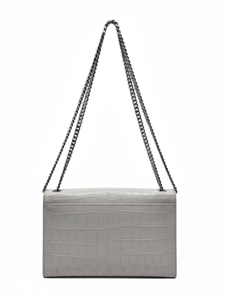 Posh Purse Co white crocodile-embossed YSL Kate bag with a chain shoulder strap against a white background.