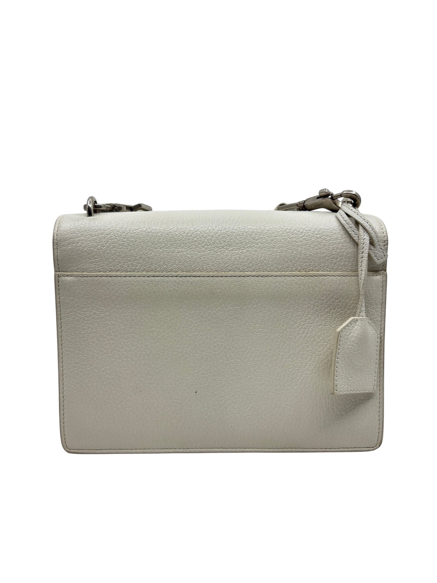 Back view of a white leather Saint Laurent Sunset medium crossbody bag from Posh Purse Co with a hanging leather tag.