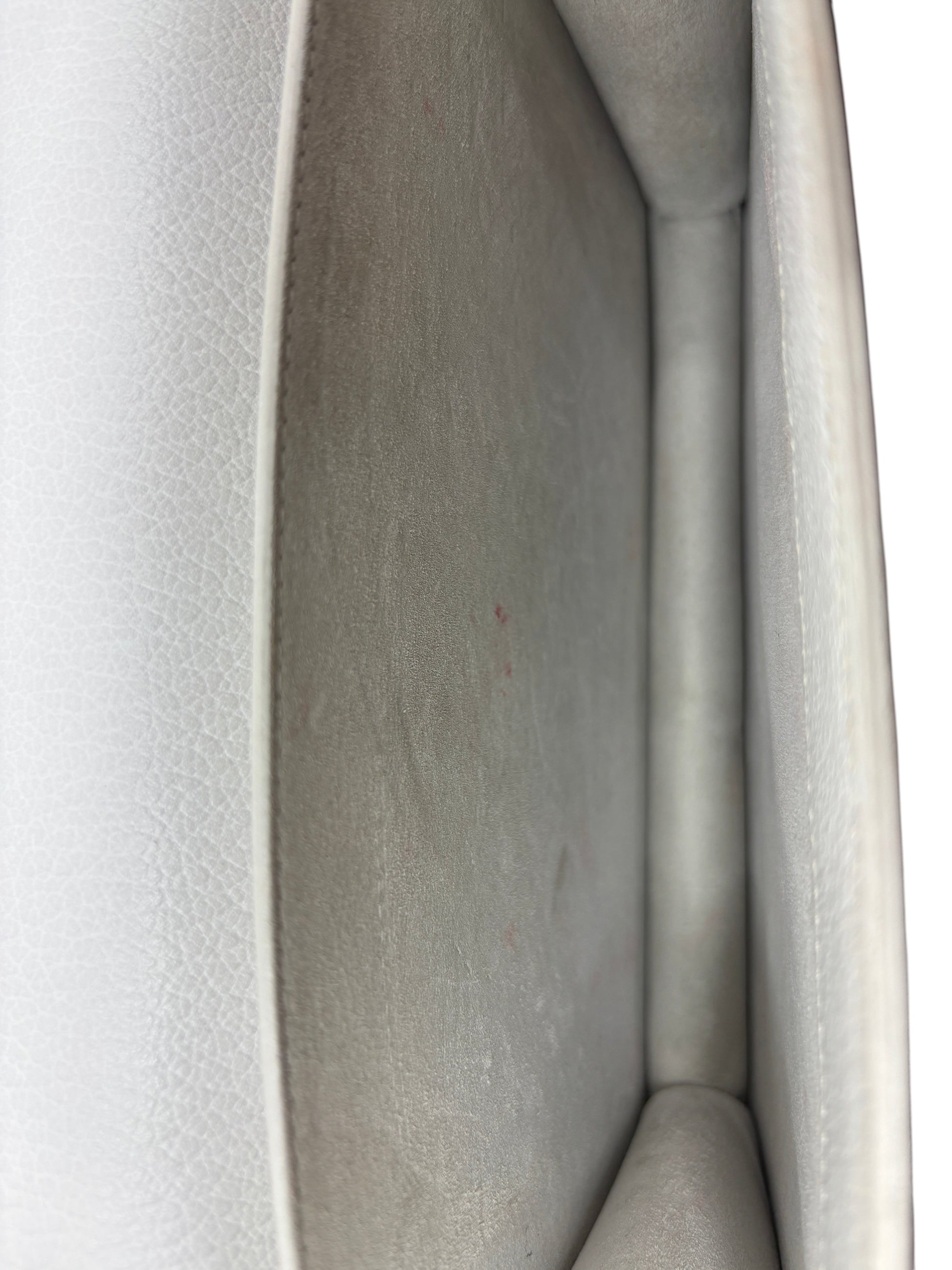 Interior view of a preloved white leather Saint Laurent Sunset bag showing light signs of wear from Posh Purse Co.