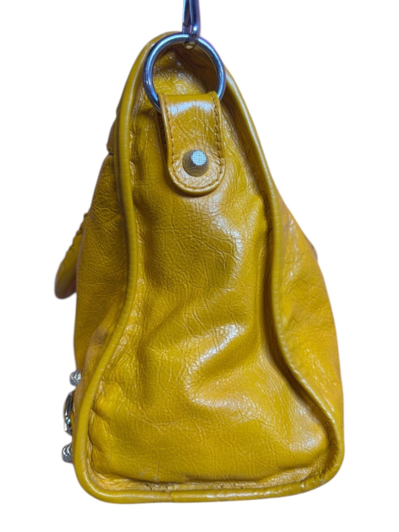Posh Purse Co. yellow Balenciaga Agneau City Bag made of soft lambskin leather with signature hardware and stud accents.