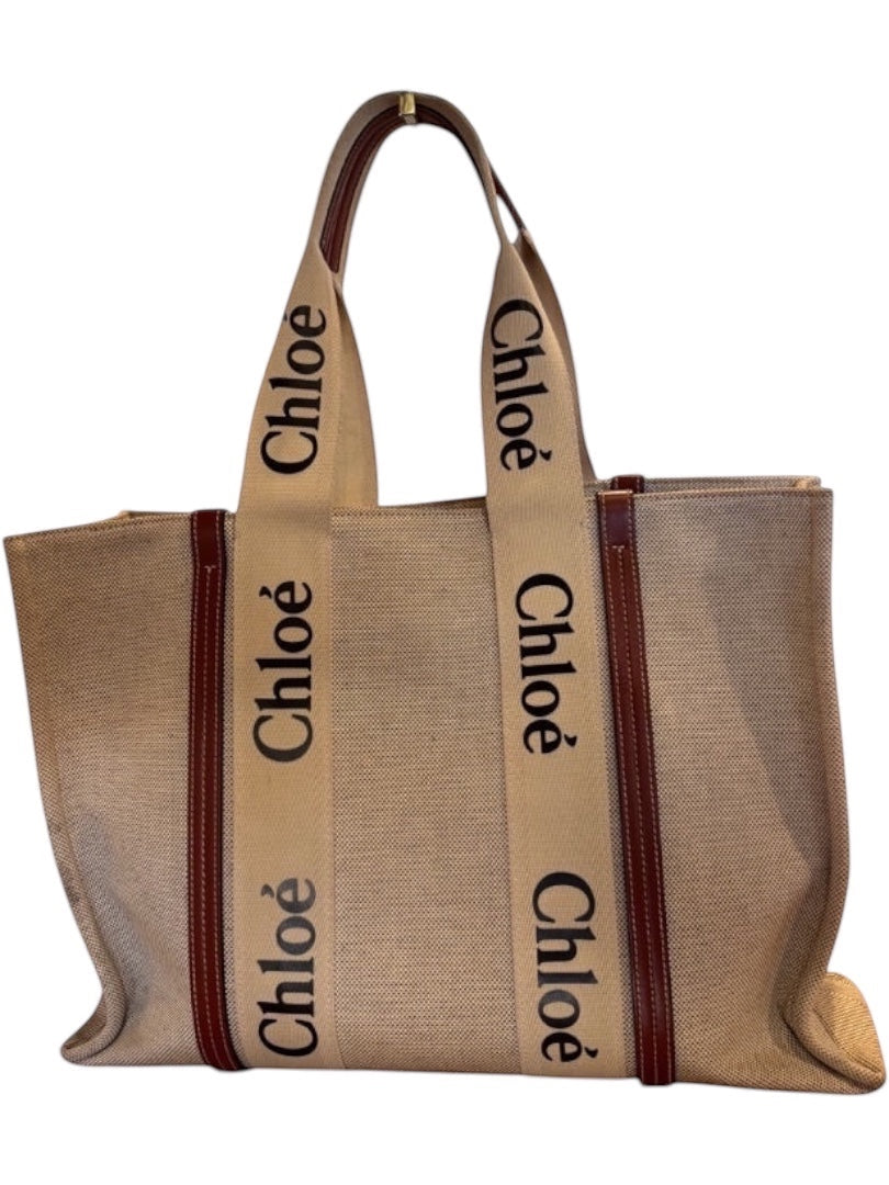 Posh Purse Co beige canvas large Chloe Woody tote bag with brown leather trim and signature Chloe logo straps.