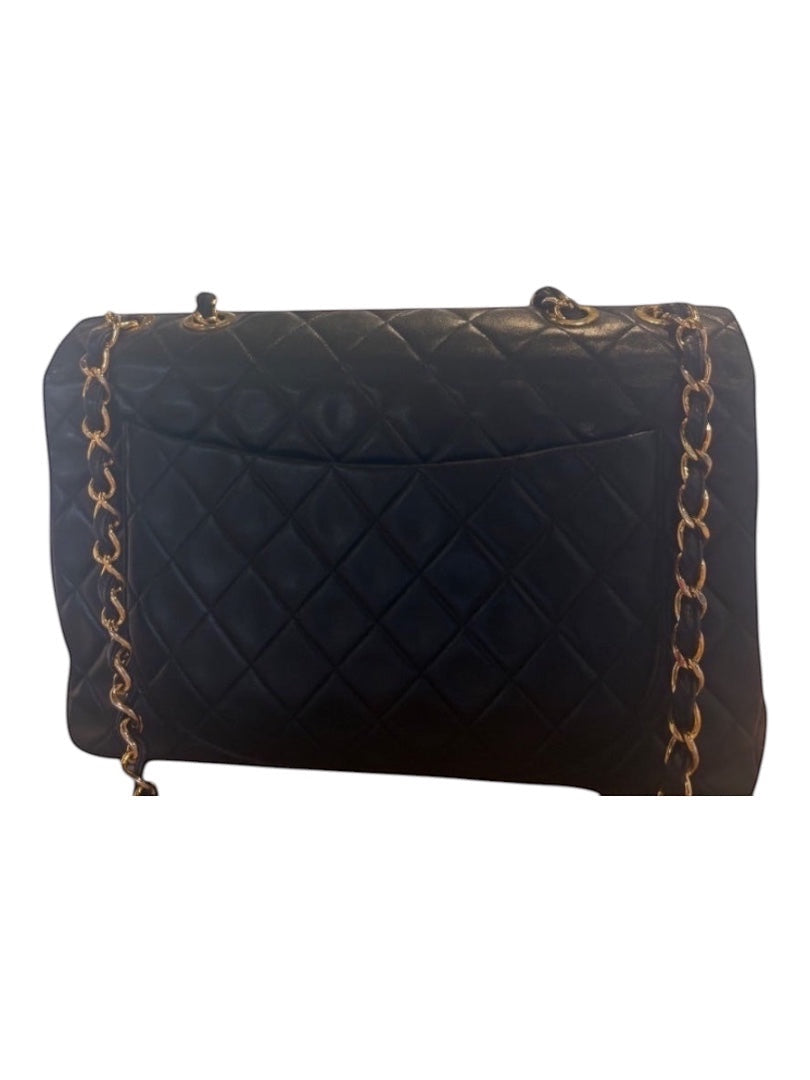 Posh Purse Co black quilted calfskin jumbo flap bag with gold chain strap and hardware.