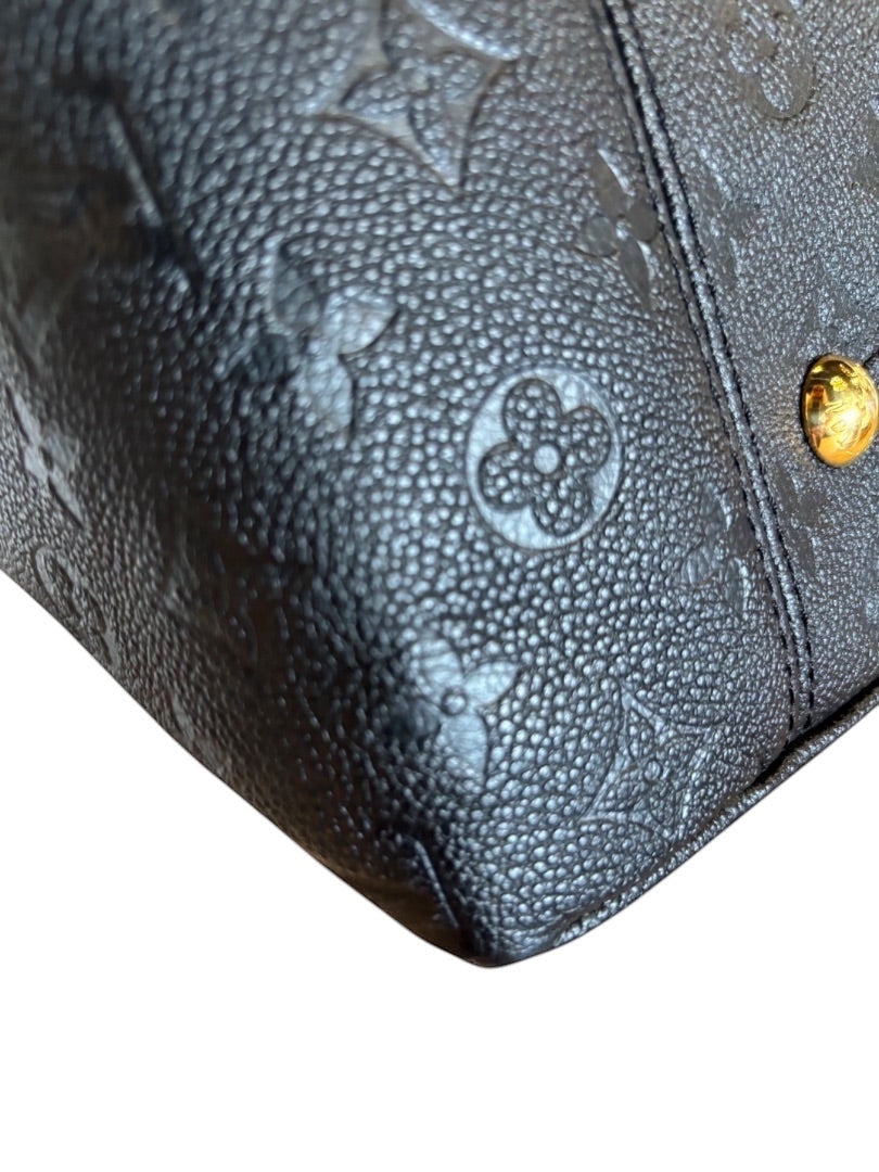 Posh Purse Co black Louis Vuitton Artsy MM hobo bag in embossed leather with gold-tone hardware.