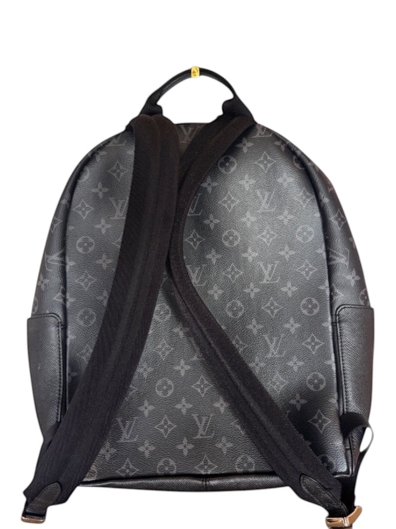 Posh Purse Co black Louis Vuitton Discovery backpack in coated canvas with leather trim and signature monogram pattern.