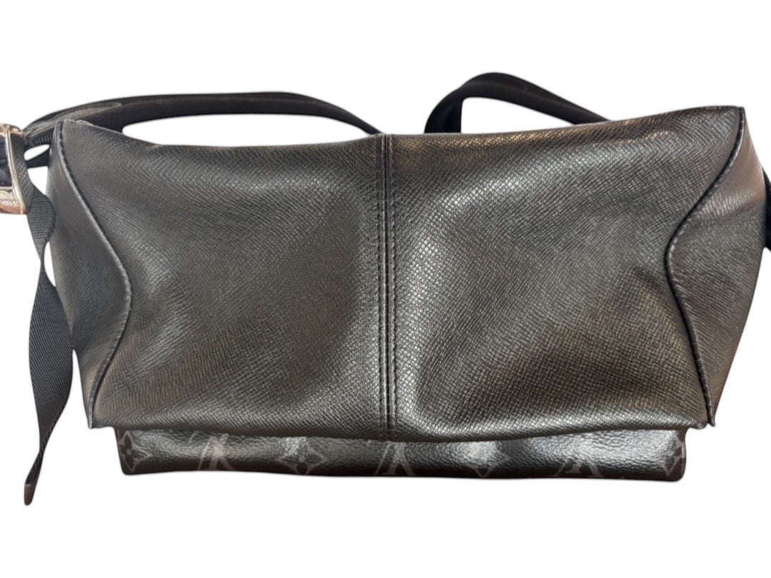 Posh Purse Co black Louis Vuitton Discovery backpack in coated canvas with leather trim and silver-tone hardware.