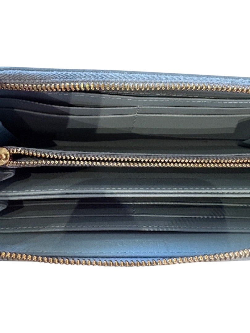 Posh Purse Co. blue leather Dior Voyageur wallet interior with multiple card slots and zippered compartments.