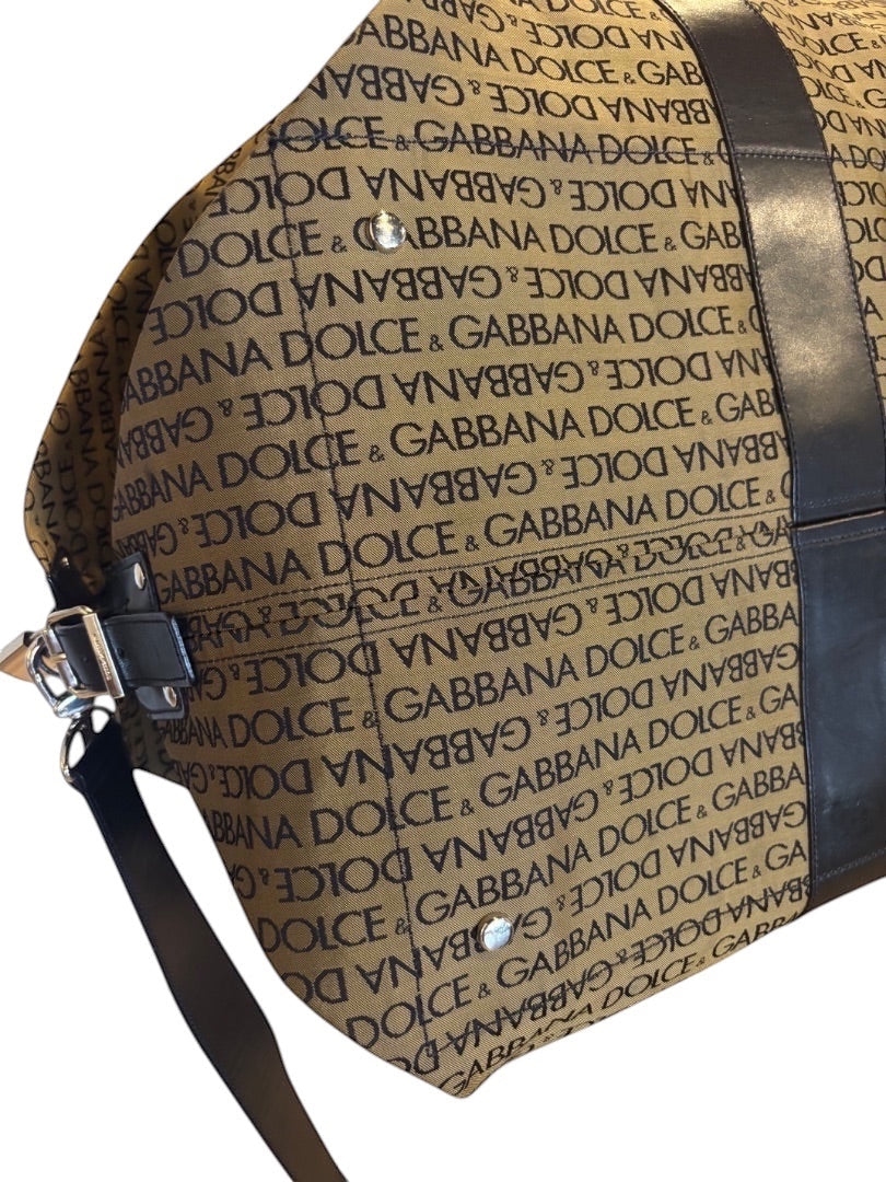 Posh Purse Co Dolce & Gabbana tan canvas weekend duffel bag with black logo print and leather trim.