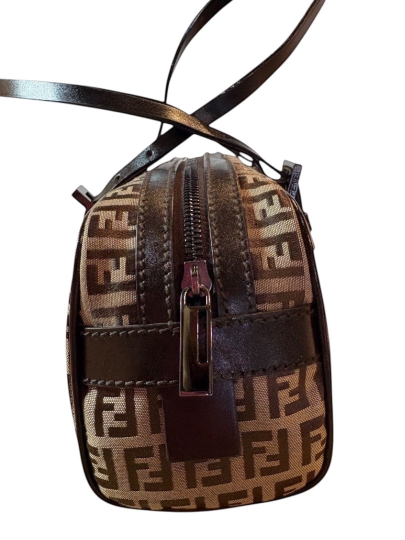 Posh Purse Co Fendi Barrel Bauletto bag in brown Zucca canvas with dark brown leather trim and silver hardware. Features double top handles and zip closure.