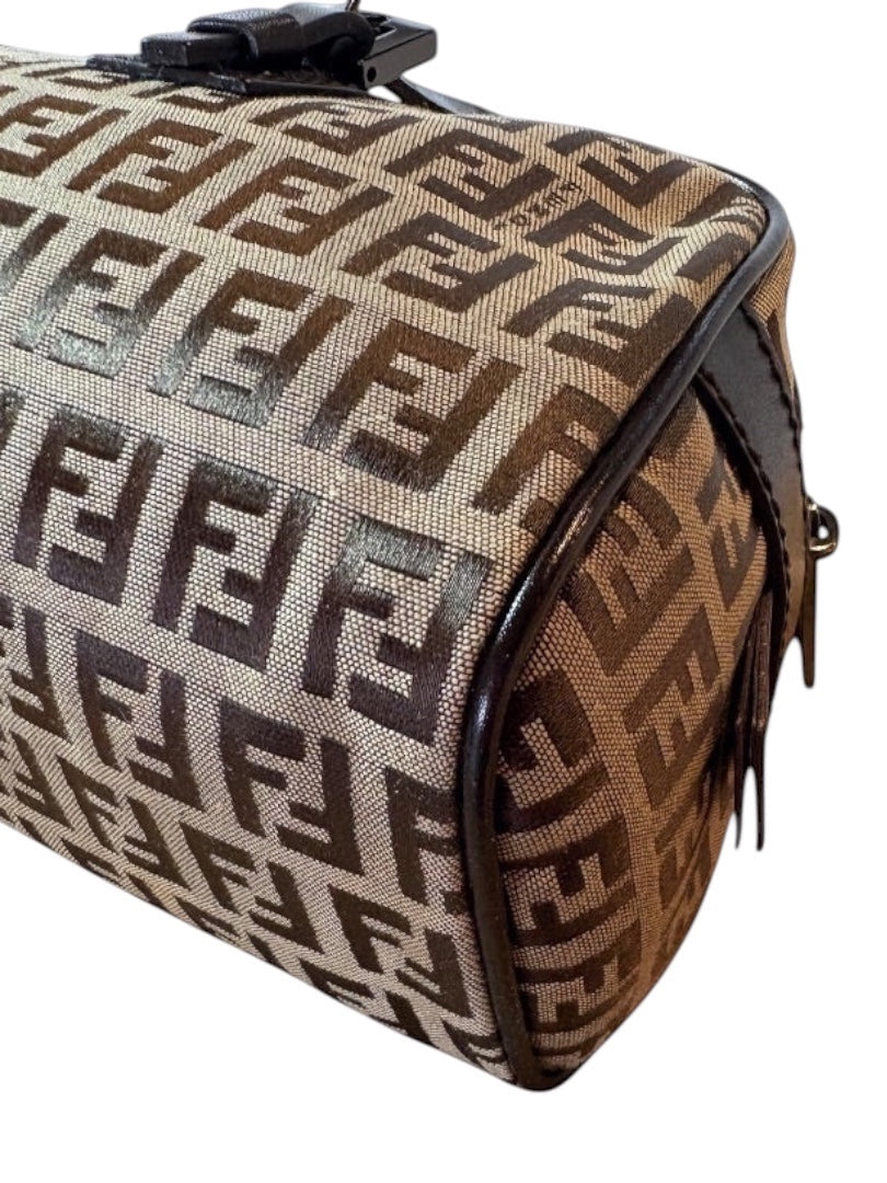 Posh Purse Co Fendi Barrel Bauletto bag in brown Zucca canvas with dark brown leather trim. Features iconic FF logo pattern and zip top closure.