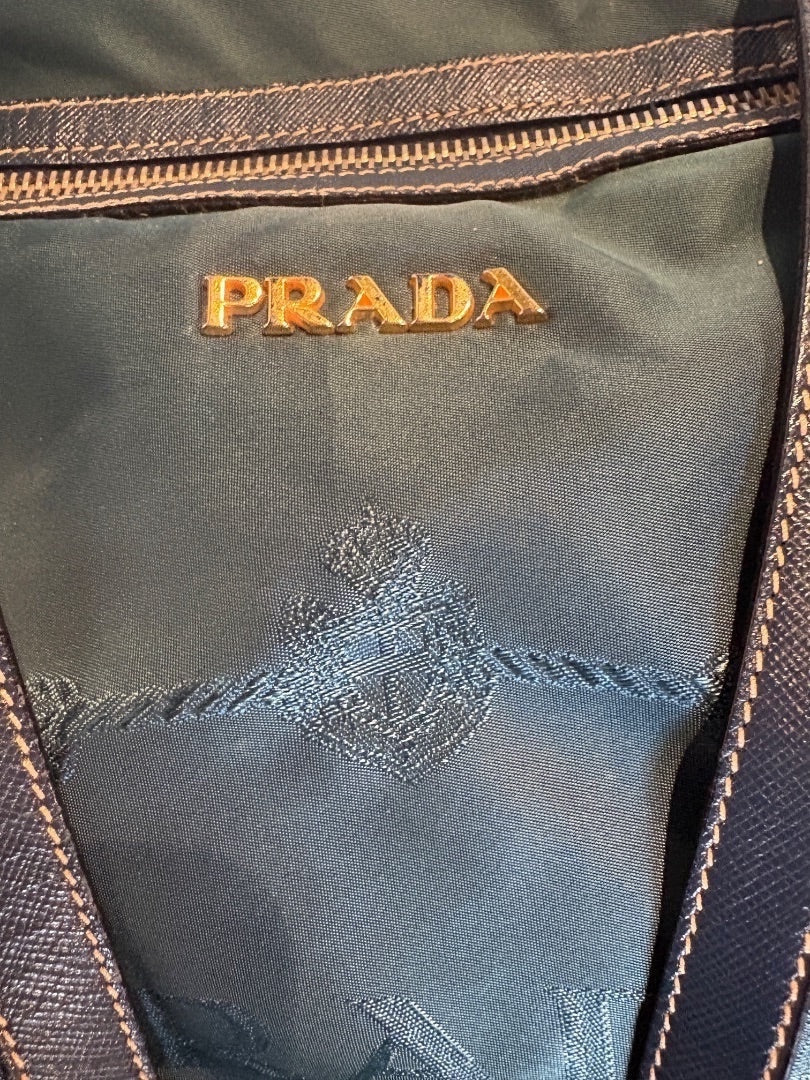 Posh Purse Co green Prada Tessuto nylon bag with gold logo plaque and embroidered crest detail.