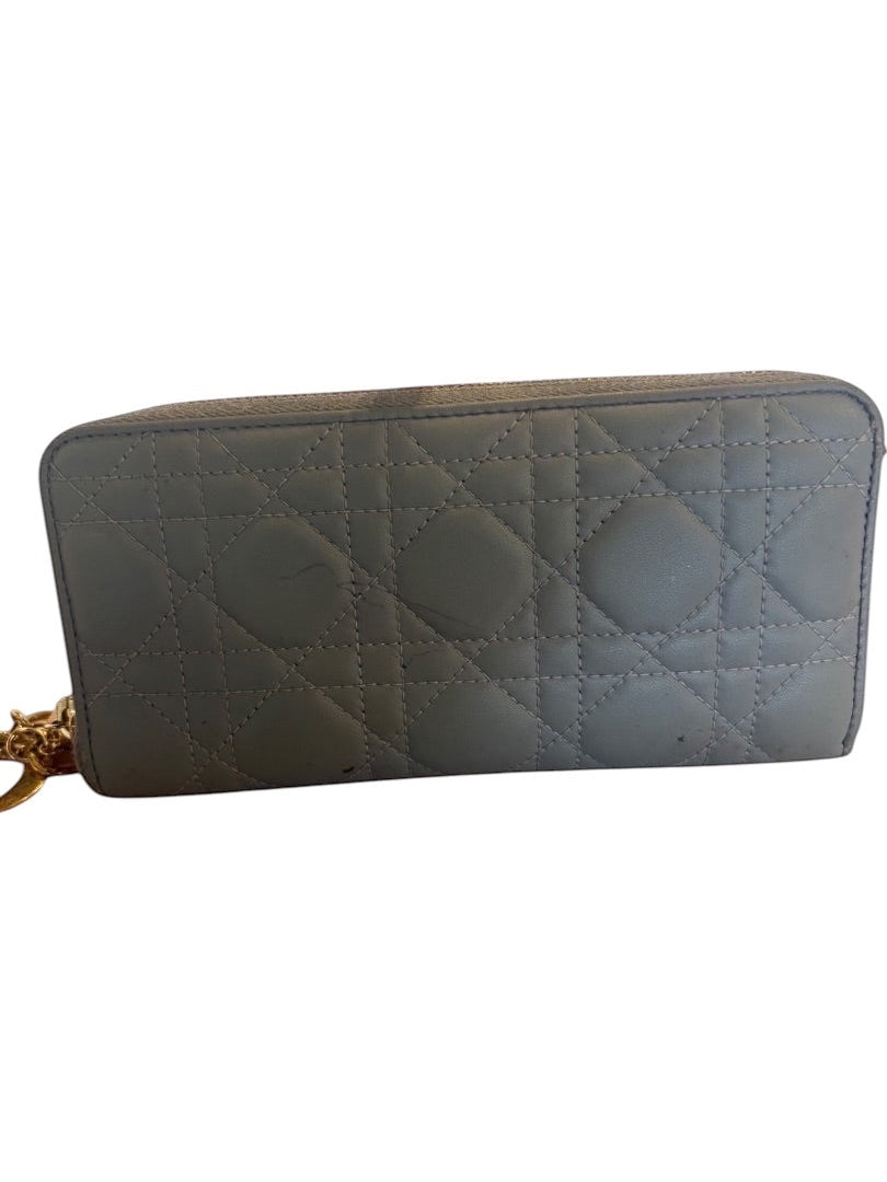 Posh Purse Co. grey leather Dior Voyageur wallet with Cannage quilting and gold charm. Shows exterior ink marks.