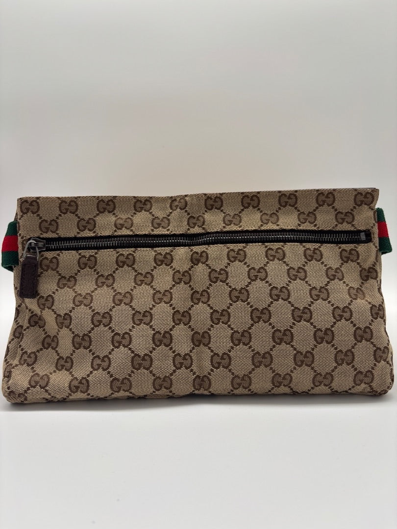 Posh Purse Co Gucci belt bag in beige GG canvas with green and red web stripe strap and zip closure.
