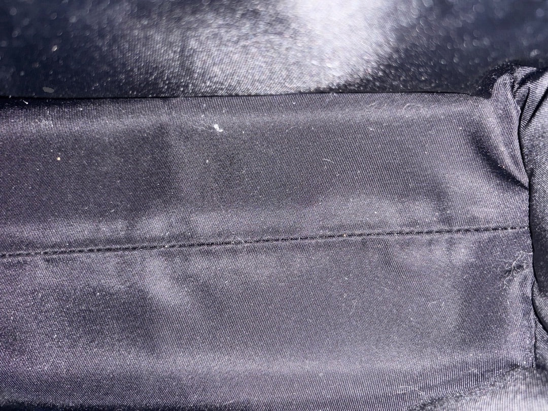 Posh Purse Co Gucci Children's GG Supreme bag interior lining, black fabric with stitched detail.