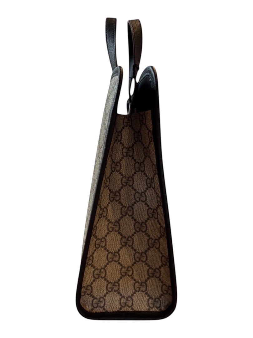Posh Purse Co Gucci Children’s GG Supreme canvas tote bag with brown monogram pattern and black leather trim and handles.
